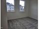 Cozy bedroom with plush carpeting and plenty of natural light from the double windows at 813 Emmer St, Rolesville, NC 27571