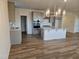 Modern kitchen featuring gray cabinets, stainless steel appliances, pantry and center island with a white countertop at 813 Emmer St, Rolesville, NC 27571