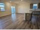Bright kitchen featuring an island, stainless appliances, and a view of the sliding glass door to the balcony at 813 Emmer St, Rolesville, NC 27571