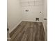 Bright laundry room with stylish laminate flooring, ample space, and convenient hookups for appliances at 813 Emmer St, Rolesville, NC 27571
