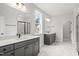 Bathroom with double vanity, marble tile, and glass-enclosed shower in neutral tones for a modern aesthetic at 9169 Dupree Meadow Dr # 26, Angier, NC 27501