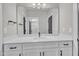 Bathroom featuring a white vanity with a sink, a large mirror, and modern fixtures at 9169 Dupree Meadow Dr # 26, Angier, NC 27501