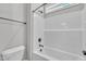 Bathroom featuring a toilet, tub, shower, and sleek black fixtures for a modern aesthetic at 9169 Dupree Meadow Dr # 26, Angier, NC 27501