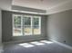 Spacious bedroom featuring a large window overlooking the property at 9169 Dupree Meadow Dr # 26, Angier, NC 27501