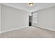 Spacious bedroom with neutral walls, plush carpeting, and a window providing natural light at 9169 Dupree Meadow Dr # 26, Angier, NC 27501