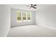 Bright and airy bedroom featuring neutral carpet, large windows, and clean white walls at 9169 Dupree Meadow Dr # 26, Angier, NC 27501