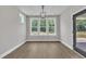 Dining room features a window view with a door to the patio at 9169 Dupree Meadow Dr # 26, Angier, NC 27501