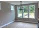 Bright dining room featuring large windows, contemporary lighting fixture, and natural light at 9169 Dupree Meadow Dr # 26, Angier, NC 27501