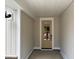 Covered porch entrance featuring a paneled wall and door with glass inserts at 9169 Dupree Meadow Dr # 26, Angier, NC 27501