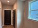 Welcoming entryway featuring a black door and neutral wall color providing a modern and clean aesthetic at 9169 Dupree Meadow Dr # 26, Angier, NC 27501