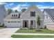 Charming single-Gathering home with a well-manicured lawn, a two-car garage, and a welcoming front porch at 9169 Dupree Meadow Dr # 26, Angier, NC 27501