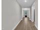 Hallway view leading to a beautifully designed front door, showcasing modern architecture at 9169 Dupree Meadow Dr # 26, Angier, NC 27501