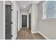 Hallway with durable flooring, neutral paint, and access to several rooms at 9169 Dupree Meadow Dr # 26, Angier, NC 27501