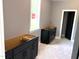 Unfinished kitchen area features dark lower cabinets and a window for natural light at 9169 Dupree Meadow Dr # 26, Angier, NC 27501