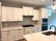 Modern kitchen featuring white cabinets, quartz countertops, stainless appliances, and designer backsplash at 9169 Dupree Meadow Dr # 26, Angier, NC 27501