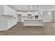 Modern kitchen featuring white cabinets, an island with seating, and stainless steel appliances at 9169 Dupree Meadow Dr # 26, Angier, NC 27501