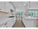 Spacious kitchen with island opens to living room with fireplace at 9169 Dupree Meadow Dr # 26, Angier, NC 27501