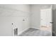 Well-lit laundry room featuring eye-catching patterned tile floor and practical wire shelving at 9169 Dupree Meadow Dr # 26, Angier, NC 27501
