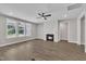 Bright living room features a fireplace, ceiling fan, and large windows at 9169 Dupree Meadow Dr # 26, Angier, NC 27501