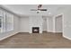 Inviting living room featuring a fireplace and large windows, complemented by elegant hardwood flooring at 9169 Dupree Meadow Dr # 26, Angier, NC 27501