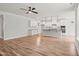 Expansive living space with a modern kitchen, hardwood floors, recessed lighting and a ceiling fan at 9169 Dupree Meadow Dr # 26, Angier, NC 27501