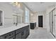 Luxurious main bathroom featuring a double vanity, modern lighting, and a frameless glass shower at 9169 Dupree Meadow Dr # 26, Angier, NC 27501