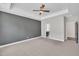 Spacious main bedroom with a tray ceiling, neutral paint and an open view of the attached bath at 9169 Dupree Meadow Dr # 26, Angier, NC 27501