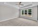 Bright main bedroom featuring a trey ceiling, recessed lighting and large windows offering natural light at 9169 Dupree Meadow Dr # 26, Angier, NC 27501