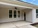 Covered patio with fan and recessed lights offers a relaxing outdoor living space with serene backyard views at 9169 Dupree Meadow Dr # 26, Angier, NC 27501