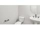 Stylish powder room featuring a modern sink, toilet, sleek black fixtures, and neutral wall paint at 9169 Dupree Meadow Dr # 26, Angier, NC 27501