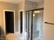 Modern shower features a glass enclosure, marble-like tile, and a built-in bench, creating a spa-like experience at 9169 Dupree Meadow Dr # 26, Angier, NC 27501