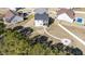 Aerial view of backyard featuring a screened in porch and a custom fire pit area at 99 Bodacious Ln, Benson, NC 27504