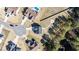 An aerial view of a home in a neighborhood featuring a pool, fire pit, and ample landscaping at 99 Bodacious Ln, Benson, NC 27504