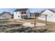 Expansive backyard featuring a stone fire pit and patio area, perfect for outdoor gatherings at 99 Bodacious Ln, Benson, NC 27504