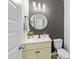 Elegant half-bath with modern fixtures, stylish mirror, and updated vanity at 99 Bodacious Ln, Benson, NC 27504