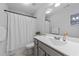 Clean bathroom featuring shower/tub, toilet, large vanity with sink, mirror, and tile flooring at 99 Bodacious Ln, Benson, NC 27504