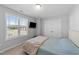 Comfortable bedroom with natural light, closet and entertainment center at 99 Bodacious Ln, Benson, NC 27504