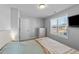 Cozy bedroom with a comfortable bed, a window for natural light, and a chest of drawers for storage at 99 Bodacious Ln, Benson, NC 27504