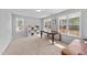 Spare bedroom with ample natural light, carpet flooring and large desk suitable for an office at 99 Bodacious Ln, Benson, NC 27504
