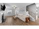 Cozy living room with hardwood floors, a ceiling fan, and a fireplace, perfect for relaxing at 99 Bodacious Ln, Benson, NC 27504