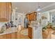 Kitchen featuring granite countertops, wood cabinets, stainless steel appliances, and an island at 1009 River Commons Dr, Knightdale, NC 27545