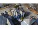 Aerial view of a beautiful house with a gray roof, surrounded by lush greenery, and neighboring houses in a suburban setting at 101 S Bloodworth St, Raleigh, NC 27601