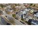 Aerial view of a cozy neighborhood featuring diverse architectural styles, tree-lined streets, and a mix of residential and commercial buildings at 101 S Bloodworth St, Raleigh, NC 27601
