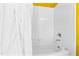 Bathtub with white tile and shower curtain at 101 S Bloodworth St, Raleigh, NC 27601