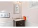 Bathroom featuring modern vanity, granite countertop, and framed art at 101 S Bloodworth St, Raleigh, NC 27601