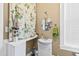 Charming bathroom with pedestal sink, round mirror, and a shower with a delightful floral curtain at 101 S Bloodworth St, Raleigh, NC 27601