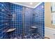 Tiled shower with a glass door, two shower heads, and marble shelving at 101 S Bloodworth St, Raleigh, NC 27601