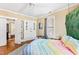 Bright bedroom featuring hardwood floors, neutral walls, and plenty of natural light at 101 S Bloodworth St, Raleigh, NC 27601