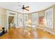 Bright dining room with hardwood floors, ample windows, and a view into another room, perfect for Gathering gatherings at 101 S Bloodworth St, Raleigh, NC 27601