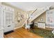 Inviting entryway with hardwood floors, a staircase, and a functional office space for a blend of style and practicality at 101 S Bloodworth St, Raleigh, NC 27601